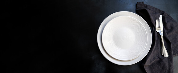 Food cooking background. Empty  craft plate on dark  table. Top view, copy space, Table setting. background for menu, layout, place for text