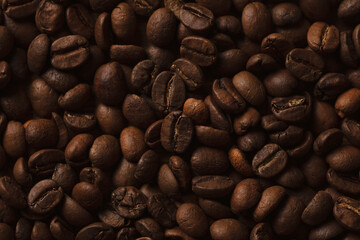 Freshly roasted coffee beans background.