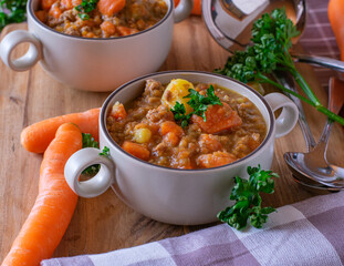 Autumnal stew with carrots, lentils, potatoes and vegetables