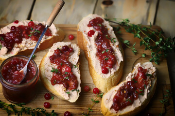 Toast with pate and cranberry jam. Goose pate toast.