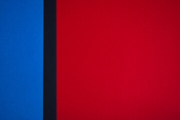 Obraz premium Red and blue divided background with black stripe, copy space