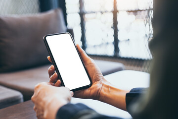 cell phone blank white screen mockup.woman hand holding texting using mobile on desk at office.background empty space for advertise.work people contact marketing business,technology