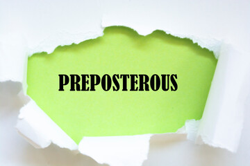 Preposterous word written under torn paper.