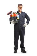 Full length portrait of a janitor holding a bucket with cleaning supplies