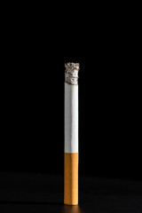 Cigarette smoking closeup isolated on balck background