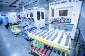 Solar panel manufacturing workshop, workers operate modern CNC machine tools. 4.0 in industry. Smart factory.