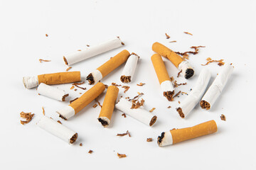 Group of cigarettes lying isolated on white background