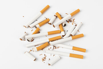 Group of cigarettes lying isolated on white background