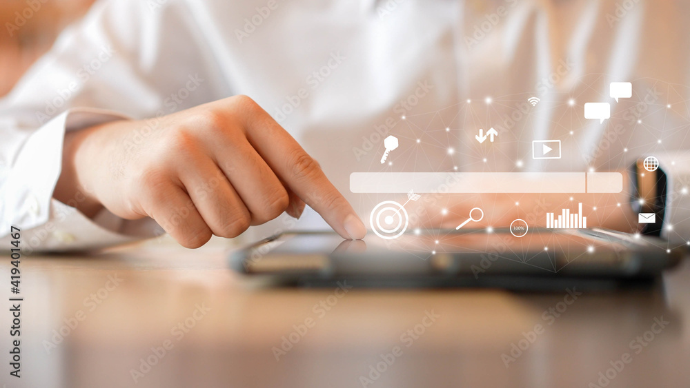 Wall mural close up man hand touchscreen on tablet to use search engine optimization (seo) tools for find custo