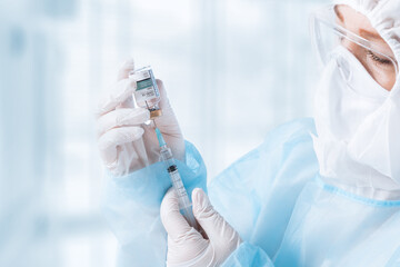 NO LOGOS OR TRADEMARKS!  SELF MADE LABELS! Close up view of doctor with an ampule of covid vaccine...