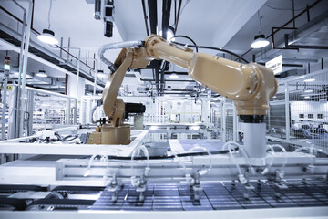Industrial robots automate arms, and modern factories produce photovoltaic panels on assembly lines. 4.0 in industry. Internet intelligent factory.