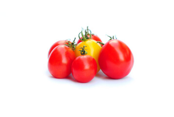 Organic tomatoes. Red and yellow plum tomatoes, paste tomatoes on a white background.
