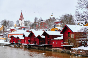 Fototapeta na wymiar Old Porvoo, with its red-ochre painted riverside warehouses, is one of the most photographed national landscapes in Finland. View from Old Bridge.