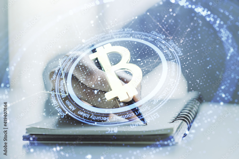 Poster double exposure of creative bitcoin symbol hologram with man hand writing in notepad on background. 