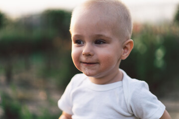 Portrait of a happy child in nature