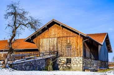 typical bavarian farmhouse near the alps