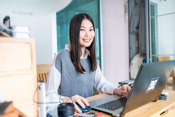 Obraz na płótnie Canvas Smiling business casual women use laptop computer connection