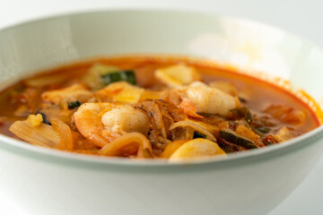 Spicy Korean-style noodle with vegetables and seafood.