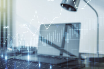 Abstract creative financial graph on modern laptop background, forex and investment concept....