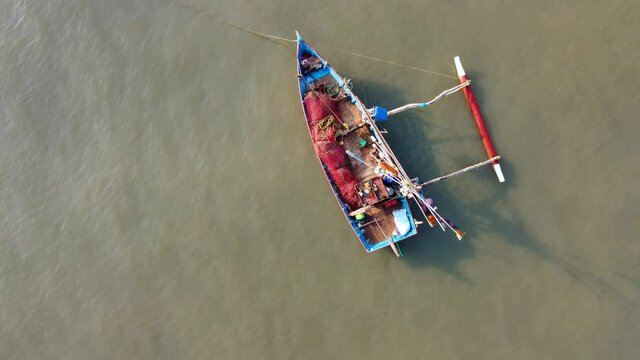 Fishing boat anchored off Ladghar beach at Dapoli, located 200 kms from Pune on the West Coast of Maharashtra India.