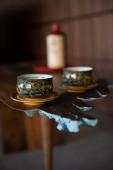 Two interesting oriental cups on a table inspired by Japanese art