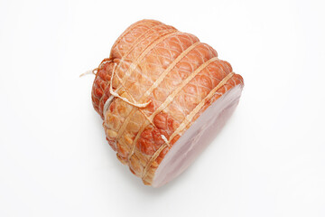 Top view of smoked ham isolated on a white background. Homemade, smoked cold cuts, in netting, cut,...