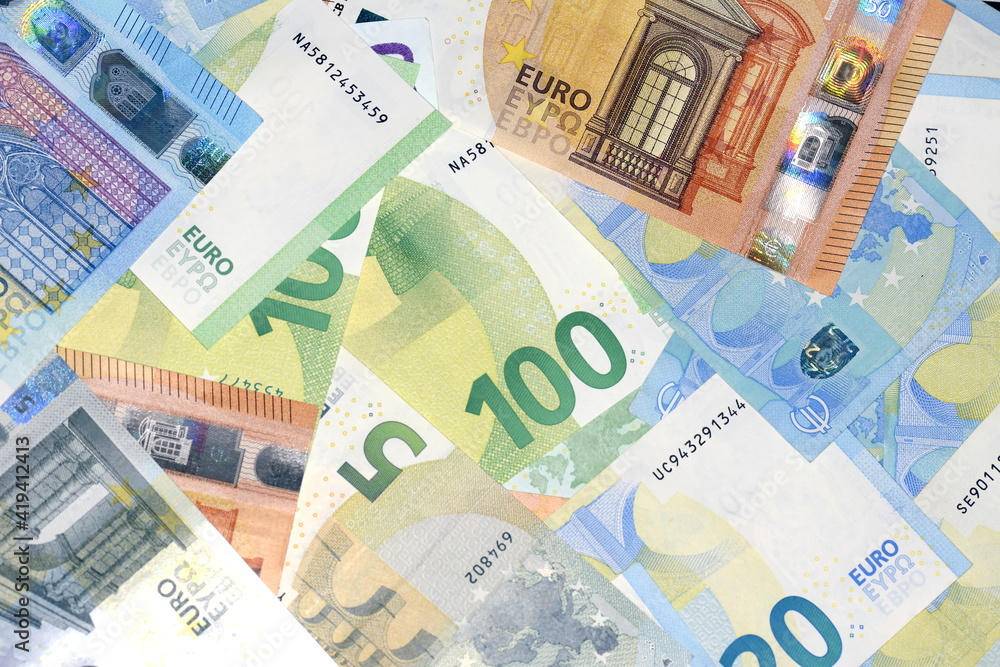 Wall mural different euro banknotes and coins