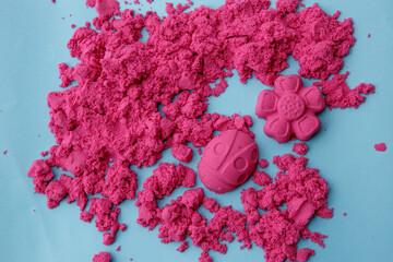children's kinetic sand on a blue background