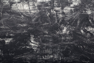 Black cement background with white scuffs. Black concrete wall background. Texture old dark stone background.Vintage anthracite wallpaper. Old scratched dark grunge plaster texture.