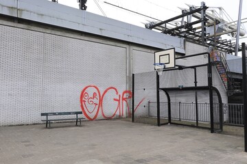 Amsterdam Basketball Court with Bench and Red Graffiti