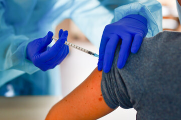 Nurse with injection vaccination against coronavirus.