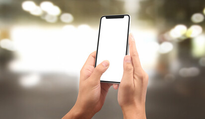 Hand holding smartphone device touching screen