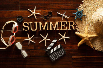 Summer related items on the wooden floor