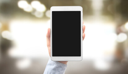 Hands holding tablet touch computer gadget