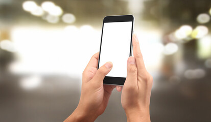 Hand holding smartphone device touching screen