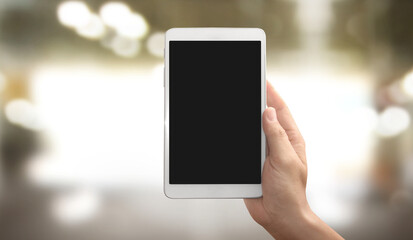 Hands holding tablet touch computer gadget