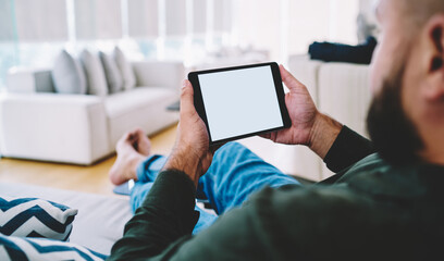 Man with tablet in horizontal position