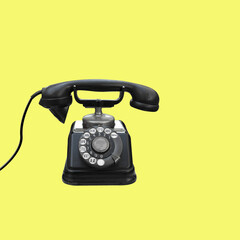 Retro telephone on yellow background
