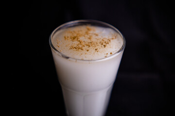 Glass of traditional Mexican horchata water with black background