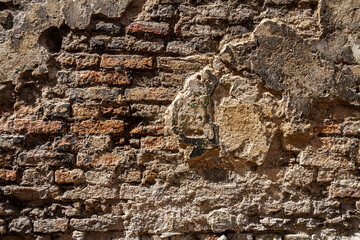 Old brick and plaster wall texture background