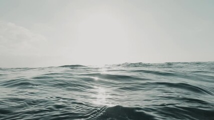 Close up of big wave passing and crashing in the sea or ocean of the beach. Paradise lifestyle concept. Underwater view outdoor.
