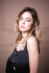 Fototapeta premium Beautiful brunette young woman posing in lingerie. Ideal slim sexy body. Girl with long hair. 