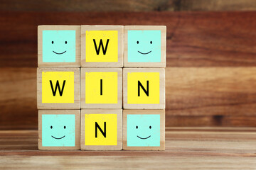 Wooden cubes stack with the text win-win-situation. Strategy and business concept