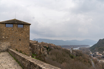 view of the castle wall and village of Ainsa in the Pyrenees of Spain