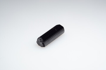 Natural black tourmaline on a white background. Sherl, sherlite