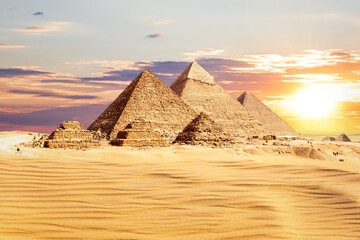 Fototapeta na wymiar The Great Pyramids of Egypt at sunset, one of the wonders of the World, Giza