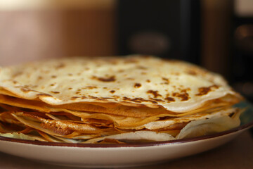 Crepes, thin pancakes on the plate. Food concept background.