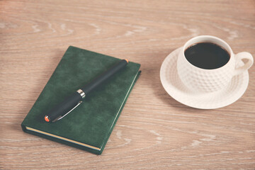 Coffee with notepad and pen