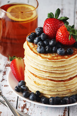 A stack if home-made pancakes with berry