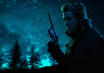 Man with handgun outdoors near fir forest under a starry sky at night.